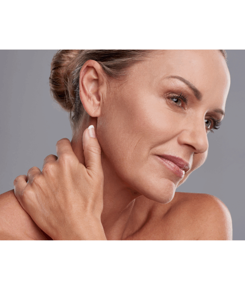 Woman touching her cheek, illustrating regenerative aesthetic care